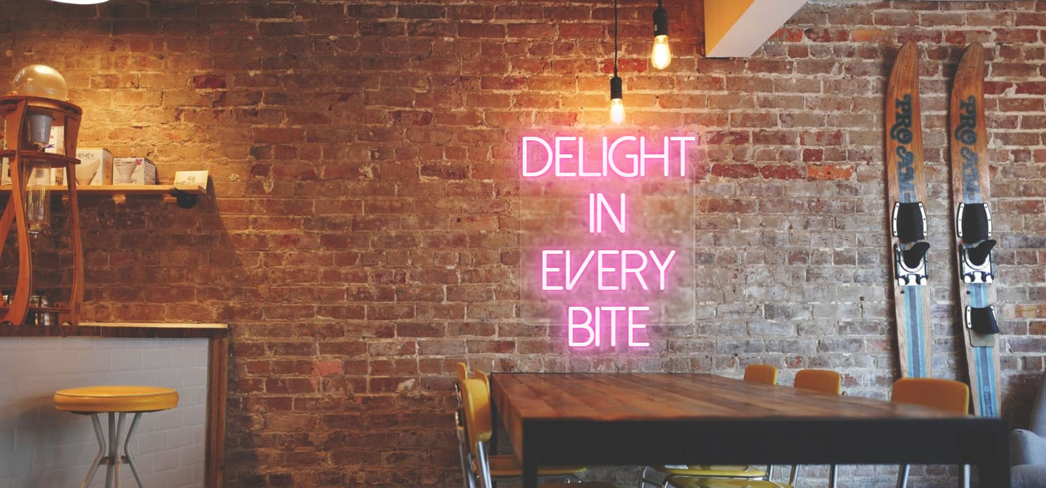 Delight in Every Bite Restaurant Sign